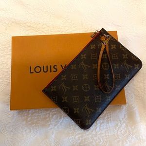 Louis Vuitton Neverfull clutch, red lining